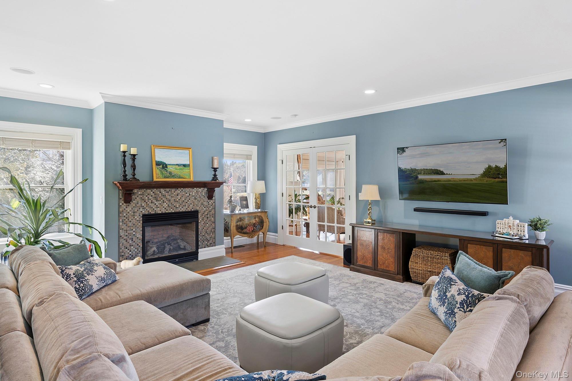 5 Woodcock Lane Remsenburg, NY 11960 - Photo 8 of 23 a living room with furniture and a fireplace