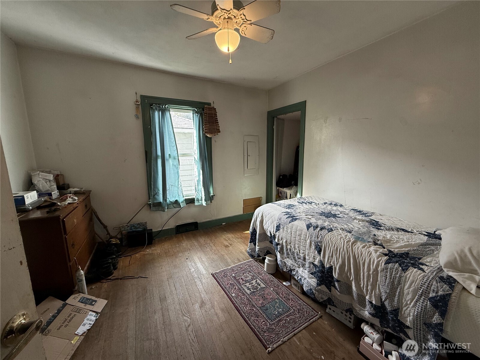 618 North 125th Street Seattle, WA 98133 - Photo 15 of 22 a bedroom with a bed and wooden floor