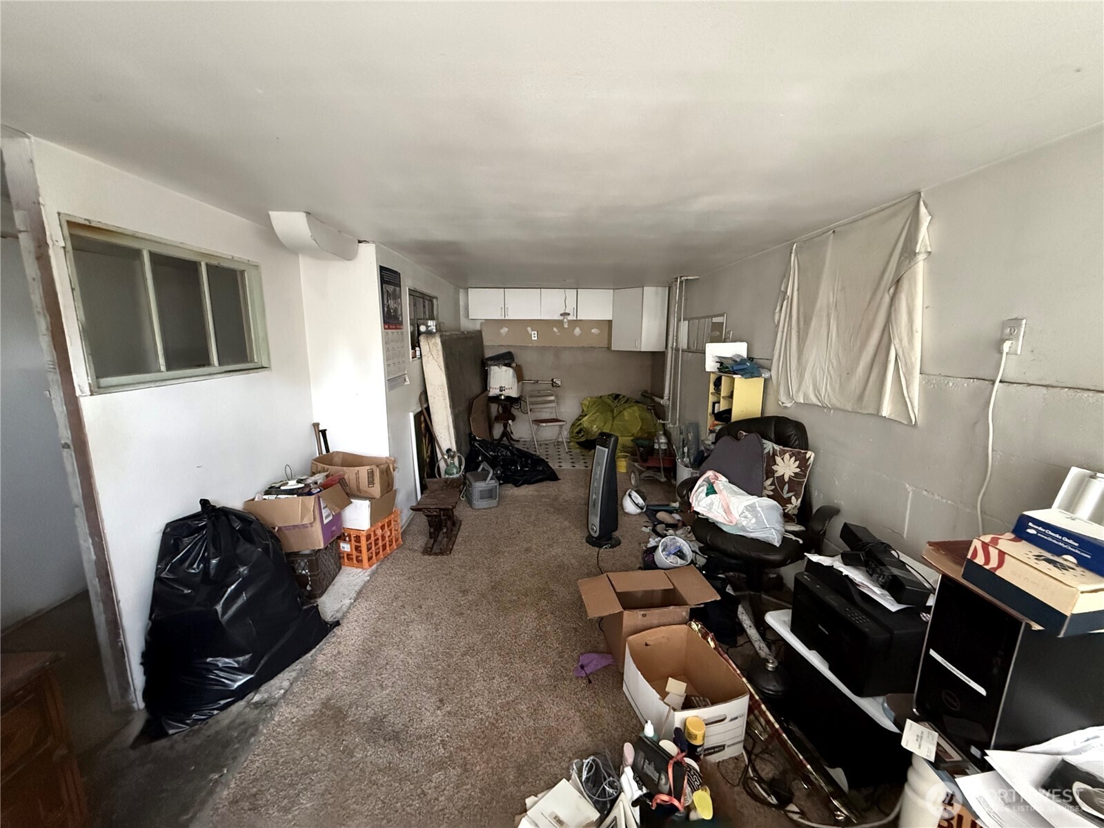 618 North 125th Street Seattle, WA 98133 - Photo 18 of 22 a living room with furniture a window and gym equipment