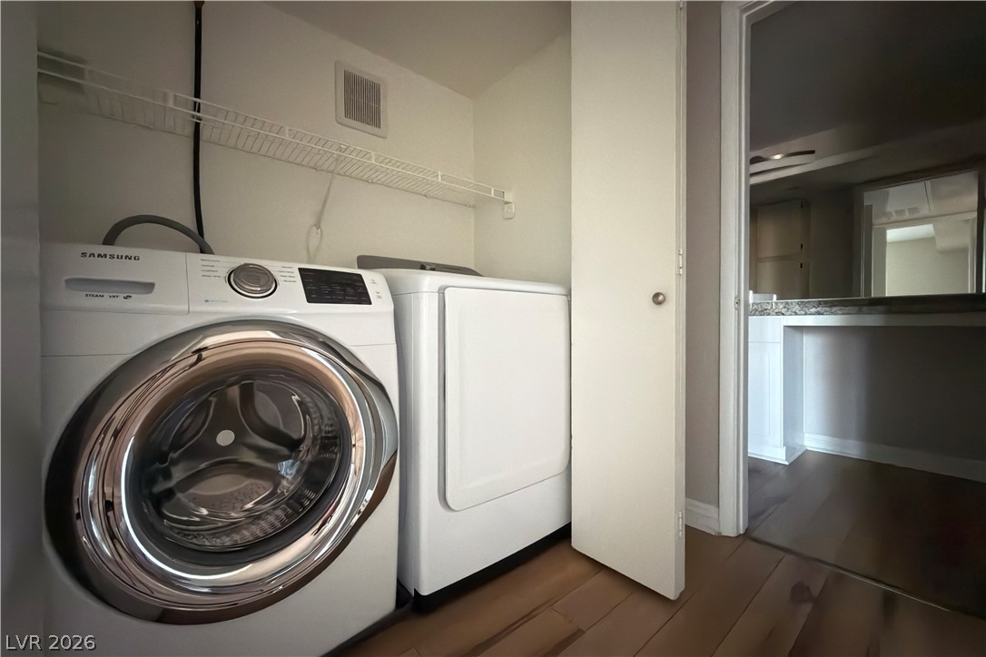 8101 West Flamingo Road, Unit 2131 Las Vegas, NV 89147 - Photo 7 of 13 A dedicated laundry space provides essential convenience within the home.