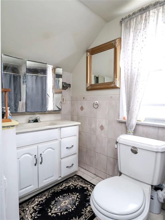 636 Holmdel Road Hazlet, NJ 07730 - Photo 32 of 47 a bathroom with a toilet a sink and a mirror