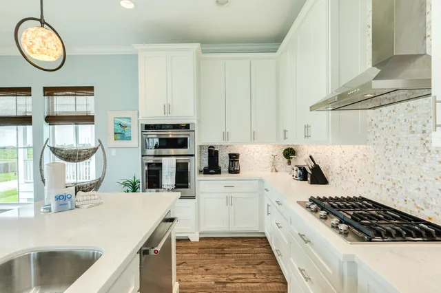 a kitchen with a stove a microwave and wooden cabinets