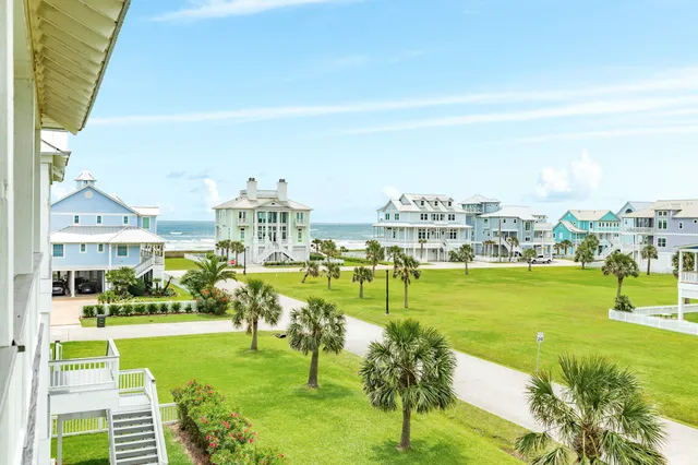 a view of swimming pool with outdoor seating and garden