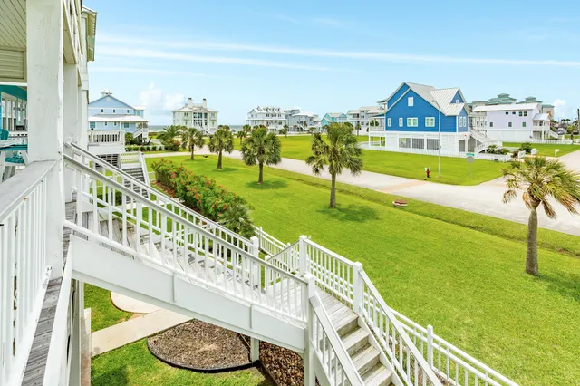 a view of balcony with wooden floor and outdoor seating