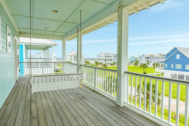 a view of a balcony with wooden floor