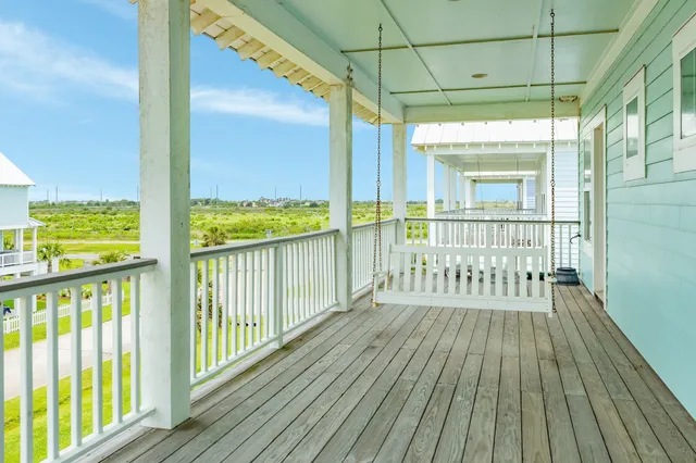 a view of a two chairs in the balcony