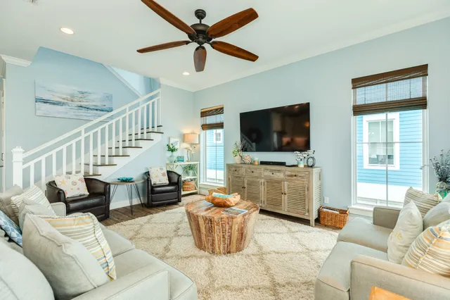 a living room with furniture and a flat screen tv
