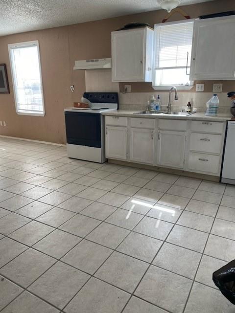 14550 Highway 78 Blue Ridge, TX 75424 - Photo 13 of 37 a kitchen with stainless steel appliances a sink a stove a microwave and cabinets