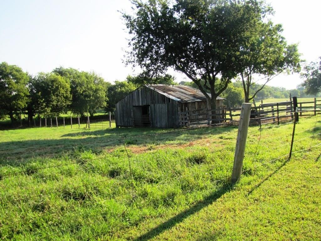 14550 Highway 78 Blue Ridge, TX 75424 - Photo 27 of 37 a view of a backyard with a small cabin