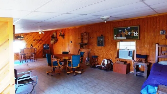 a view of a livingroom with furniture and a rug
