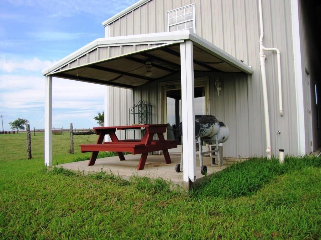 14550 Highway 78 Blue Ridge, TX 75424 - Photo 6 of 37 a view of a chairs and table in front of a house