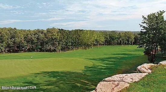 a view of a golf course with a garden