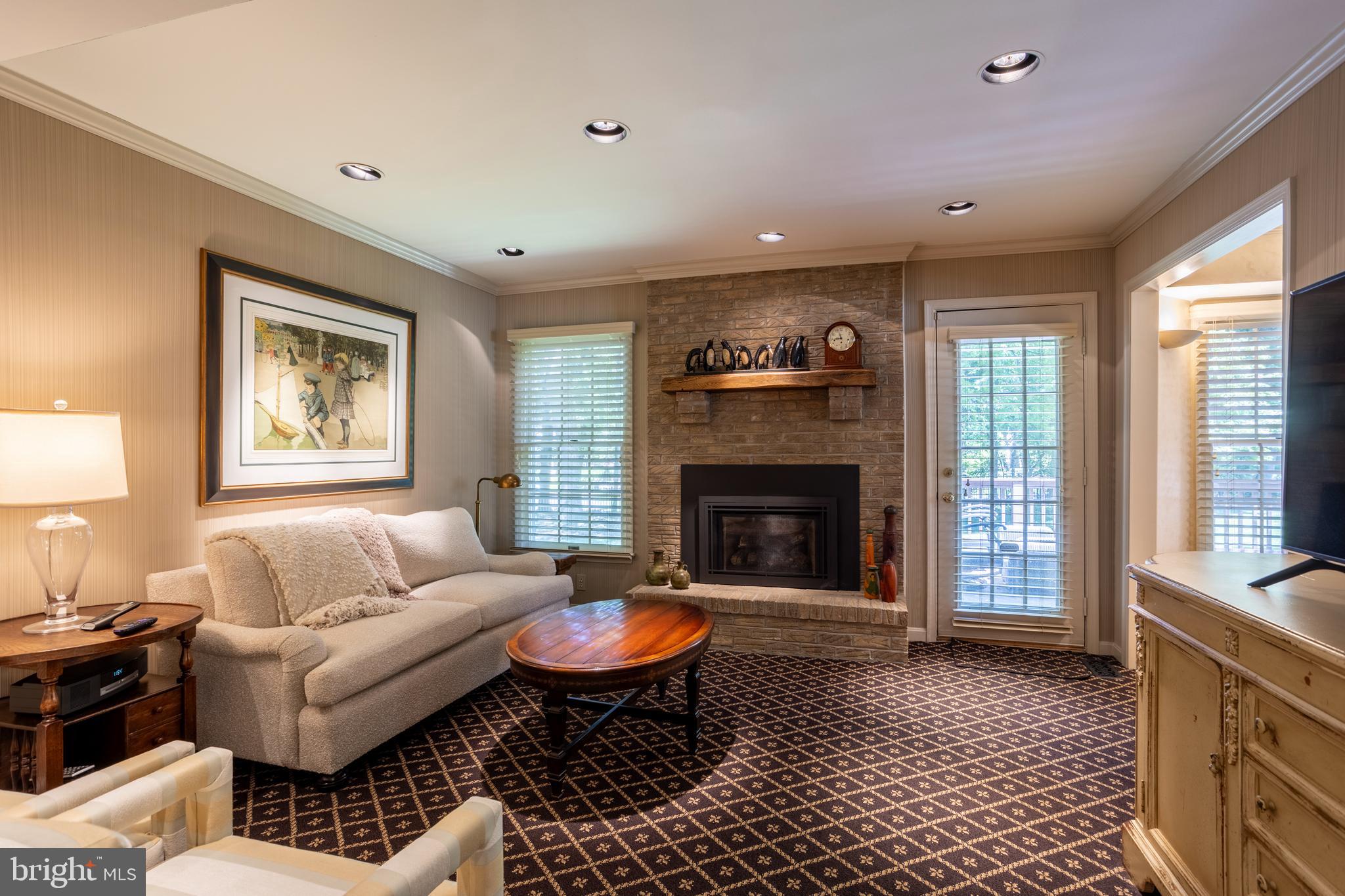 63 Raisin Tree Circle Baltimore, MD 21208 - Photo 20 of 57 a living room with furniture and a fireplace