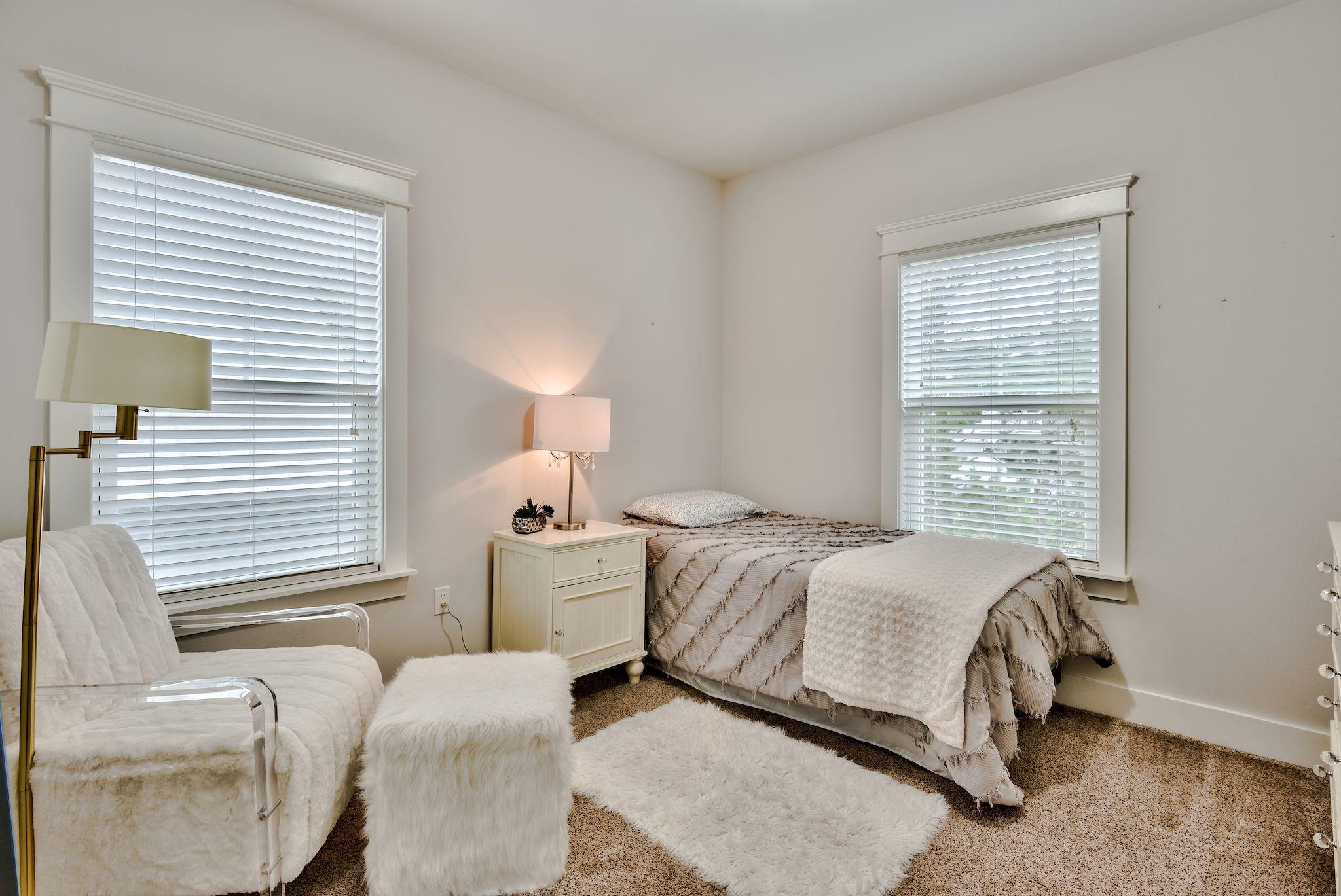 289 Emerald Beach Circle Santa Rosa Beach, FL 32459 - Photo 8 of 15 a bedroom with two beds and a large window