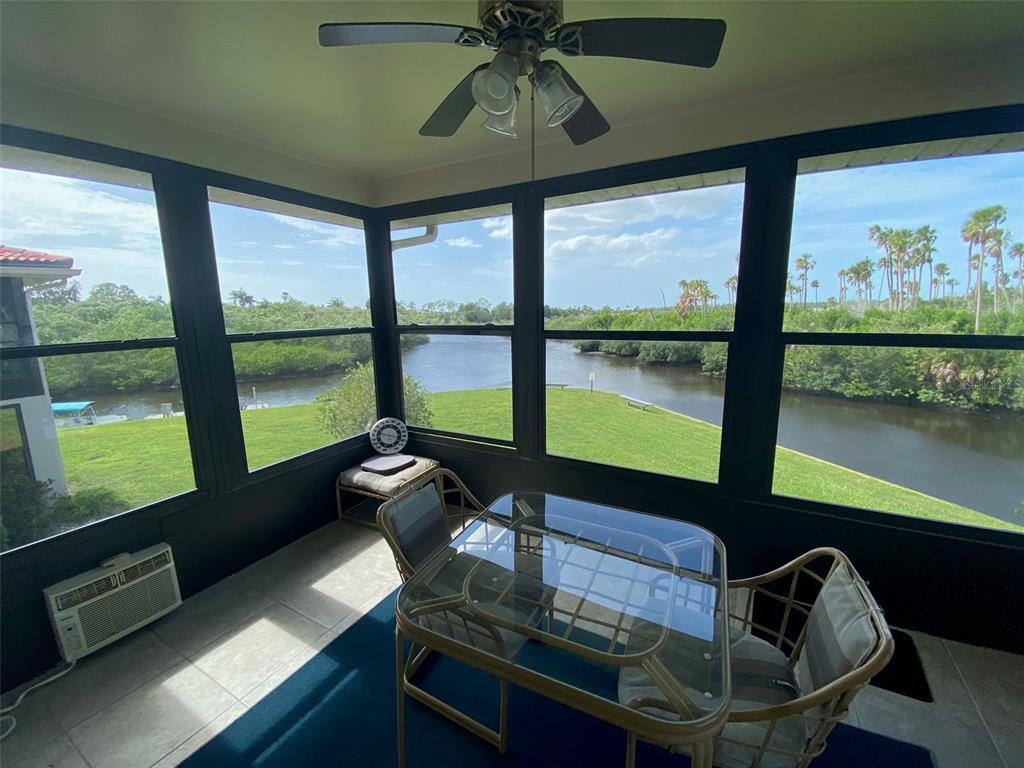 9940 Eagles Point Circle, Unit 4 Port Richey, FL 34668 - Photo 17 of 53 a living room with large window