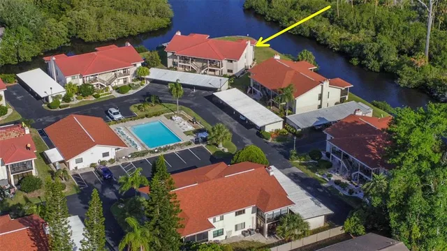 an aerial view of residential houses with outdoor space