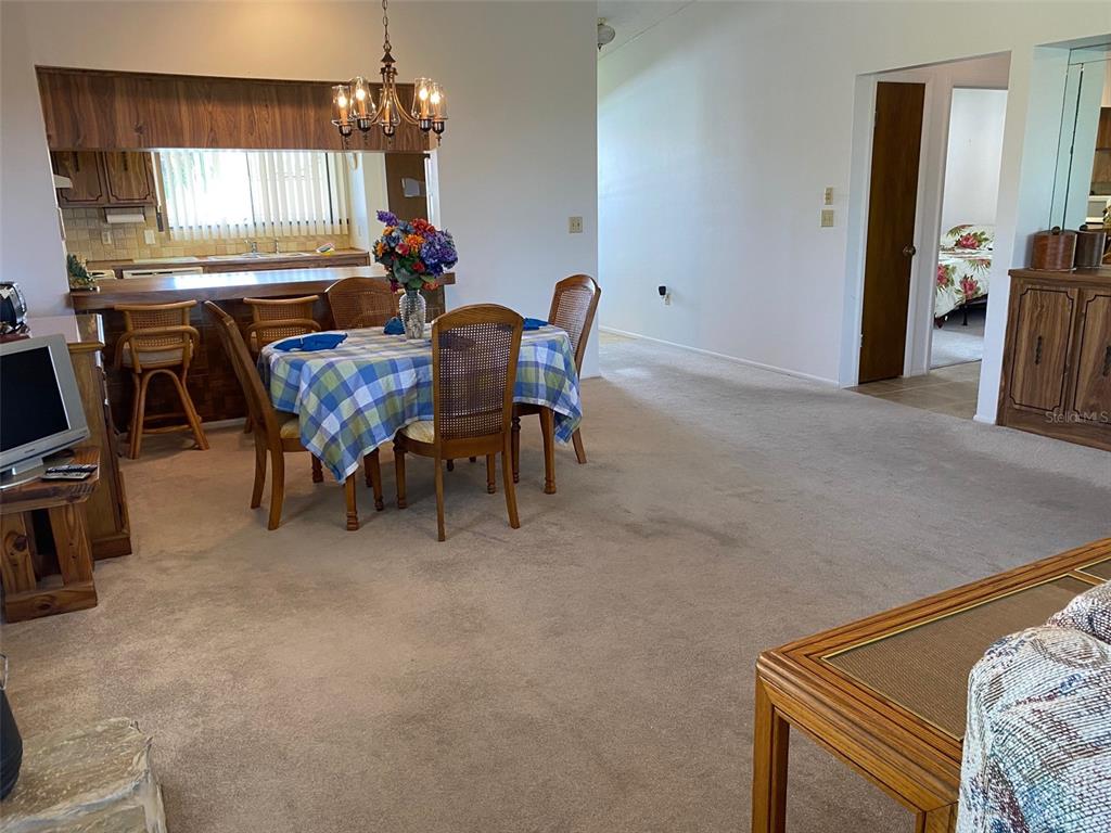 9940 Eagles Point Circle, Unit 4 Port Richey, FL 34668 - Photo 26 of 53 a view of a livingroom with furniture and window