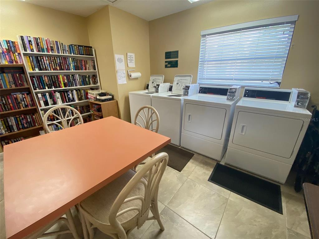 9940 Eagles Point Circle, Unit 4 Port Richey, FL 34668 - Photo 39 of 53 a room with a bed and furniture