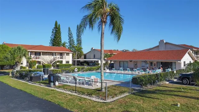 an aerial view of residential house with outdoor space and lake view