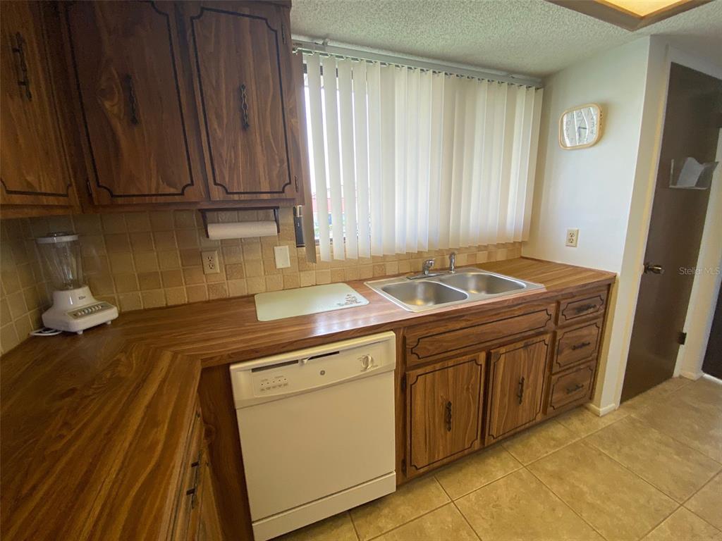 9940 Eagles Point Circle, Unit 4 Port Richey, FL 34668 - Photo 5 of 53 a room with storage and utility