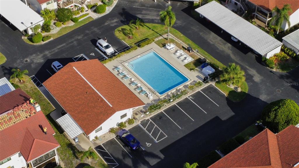 9940 Eagles Point Circle, Unit 4 Port Richey, FL 34668 - Photo 53 of 53 an aerial view of a house with a yard