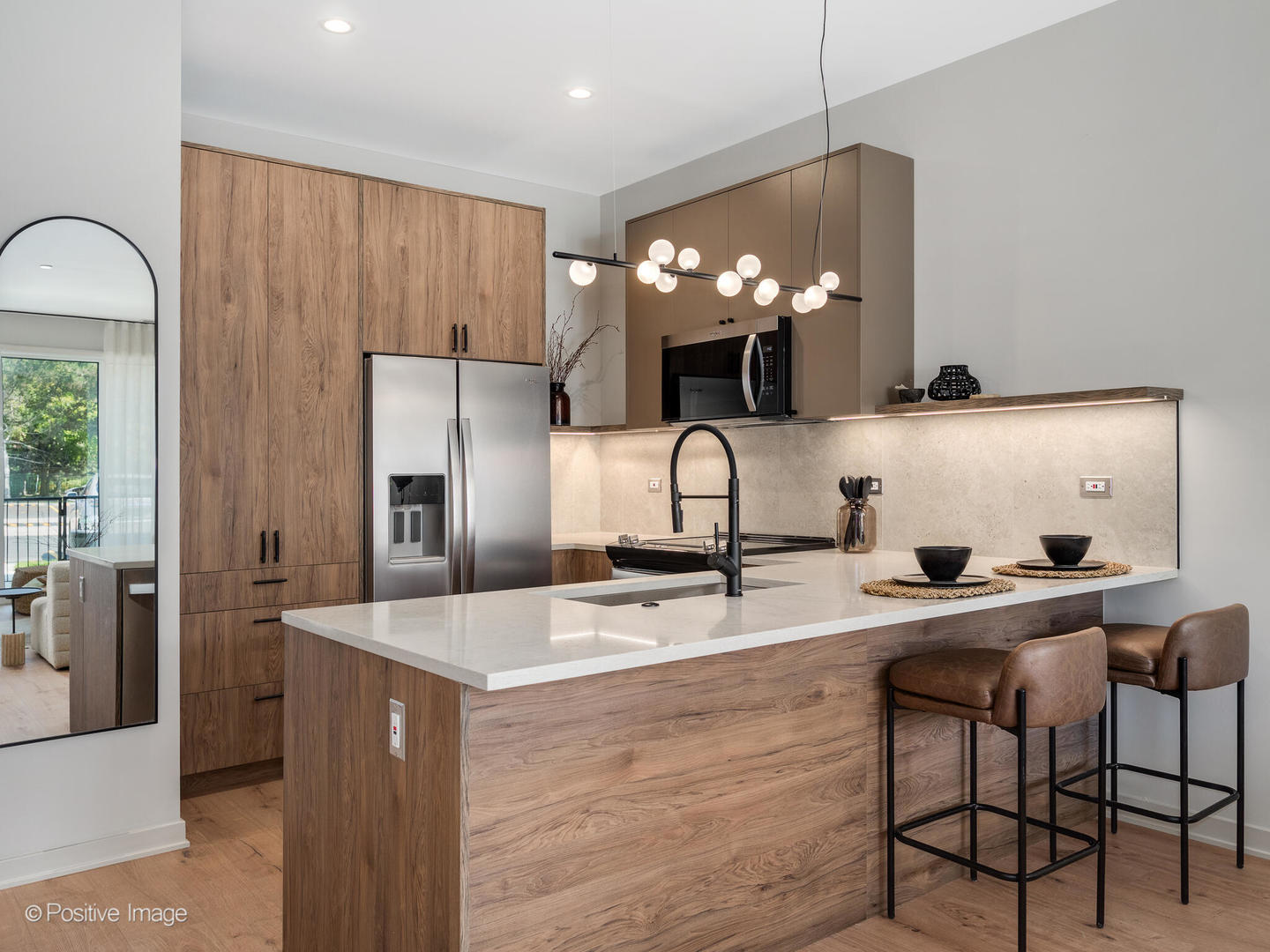 1235 North Ashland Avenue, Unit 301 Chicago, IL 60622 - Photo 5 of 25 a kitchen with stainless steel appliances a sink a stove and a refrigerator