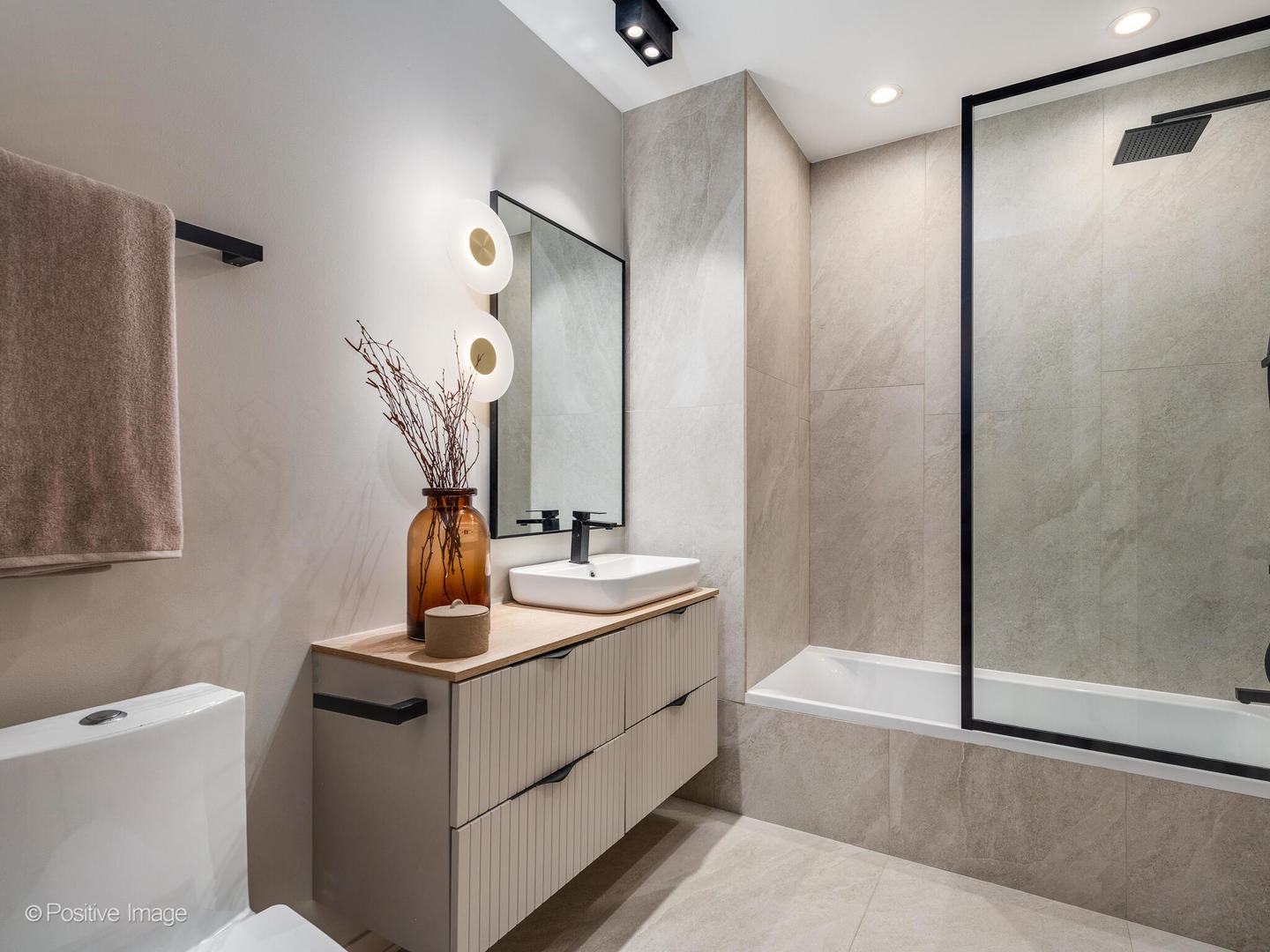 1235 North Ashland Avenue, Unit 301 Chicago, IL 60622 - Photo 10 of 25 a bathroom with a double vanity sink a mirror and a shower