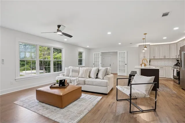 a living room with furniture and a large window