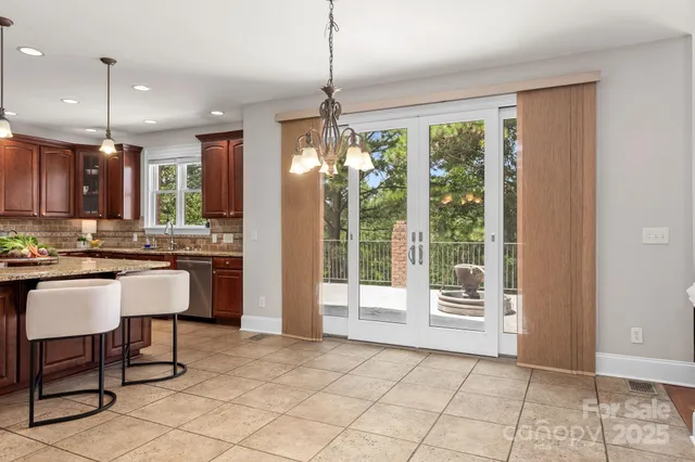 a room with kitchen island granite countertop furniture and a fireplace