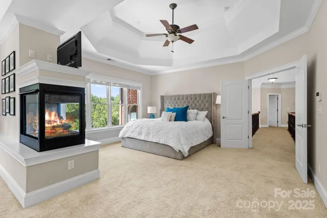 a bed room with a bed and a television