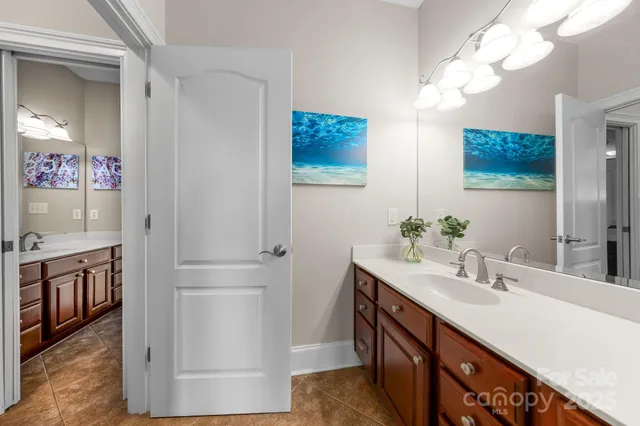 a bathroom with a sink a vanity and a mirror