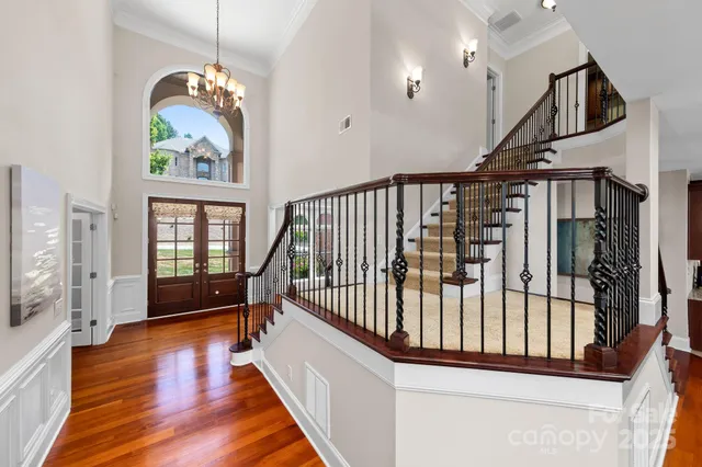 a view of entryway with stairs and wooden floor