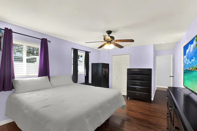 a bedroom with a bed and dresser