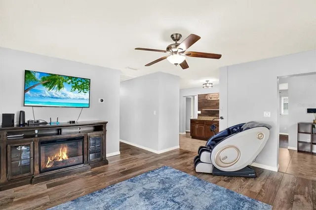 a view of a livingroom with furniture and wooden floor