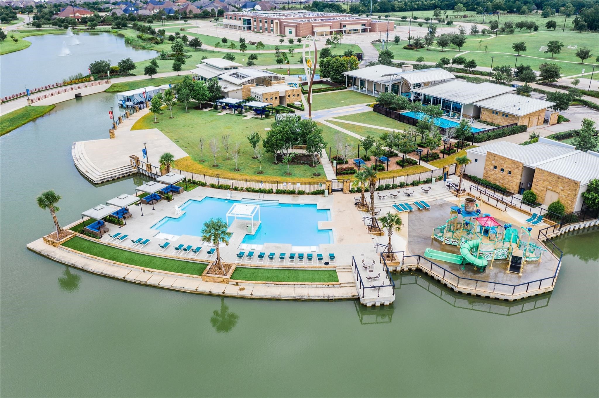 10002 Nectar Path Rosharon, TX 77583 - Photo 42 of 46 Oasis Village featuring a family pool, kiddie pool, outdoor games, and additional amenities.