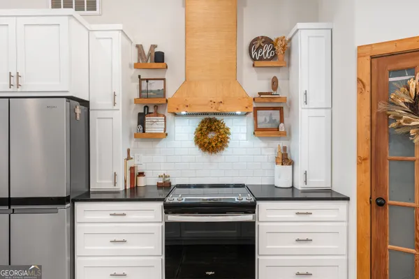 a kitchen with a sink and a window