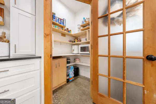 a kitchen with stainless steel appliances granite countertop a sink and a stove