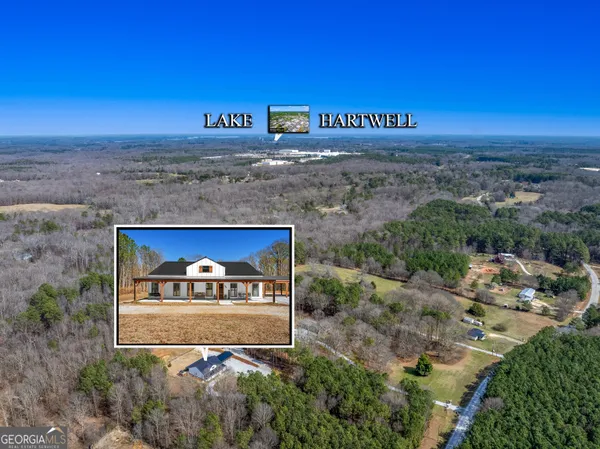 a view of a lake with a houses in the back