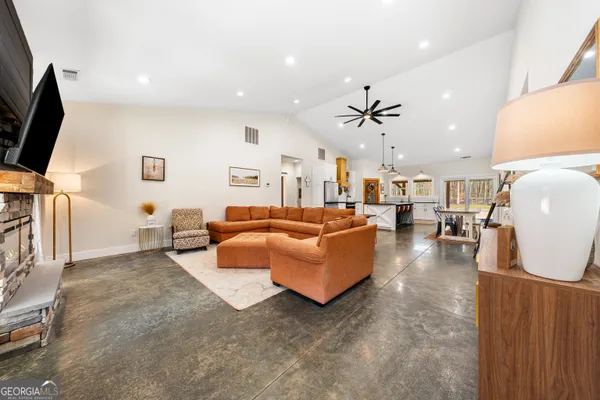 a living room with furniture and a flat screen tv