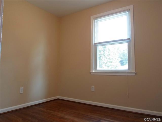 11400 Reedy Branch Road Chesterfield, VA 23838 - Photo 13 of 21 an empty room with wooden floor and a window