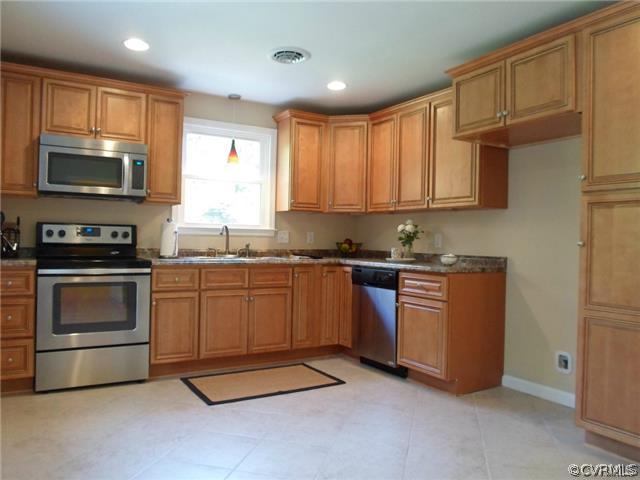 11400 Reedy Branch Road Chesterfield, VA 23838 - Photo 8 of 21 a kitchen with granite countertop a stove top oven a sink dishwasher a refrigerator and cabinets with wooden floor