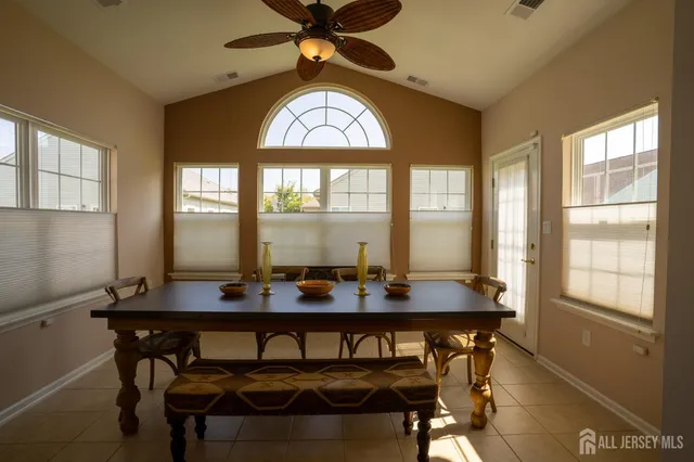 a view of a dining room with furniture window and outside view