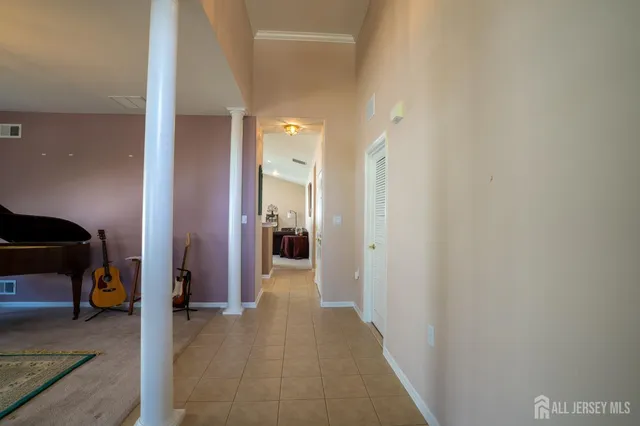 a view of a hallway with living room