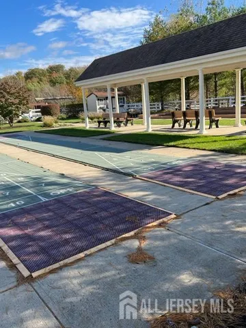 a view of a back yard of a house with a street view