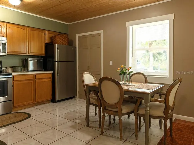a dining room with furniture and window