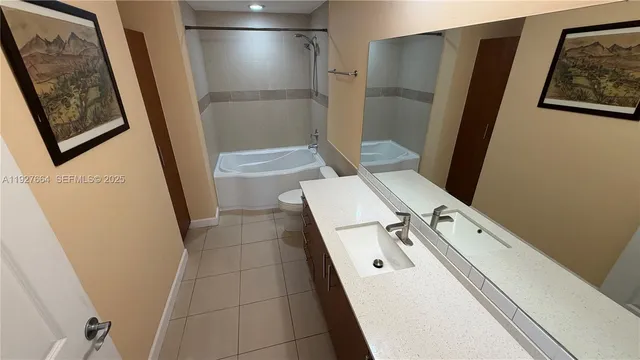 a bathroom with a sink and toilet