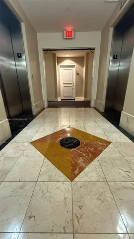 a view of a hallway with an empty room