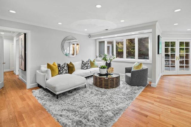 a living room with furniture rug and window