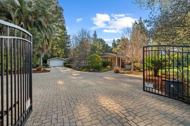 a view of a street with a car park side of the road