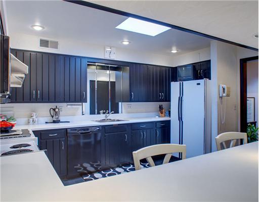 Kitchen. This open kitchen is bright, cherry and a focal point of this home.